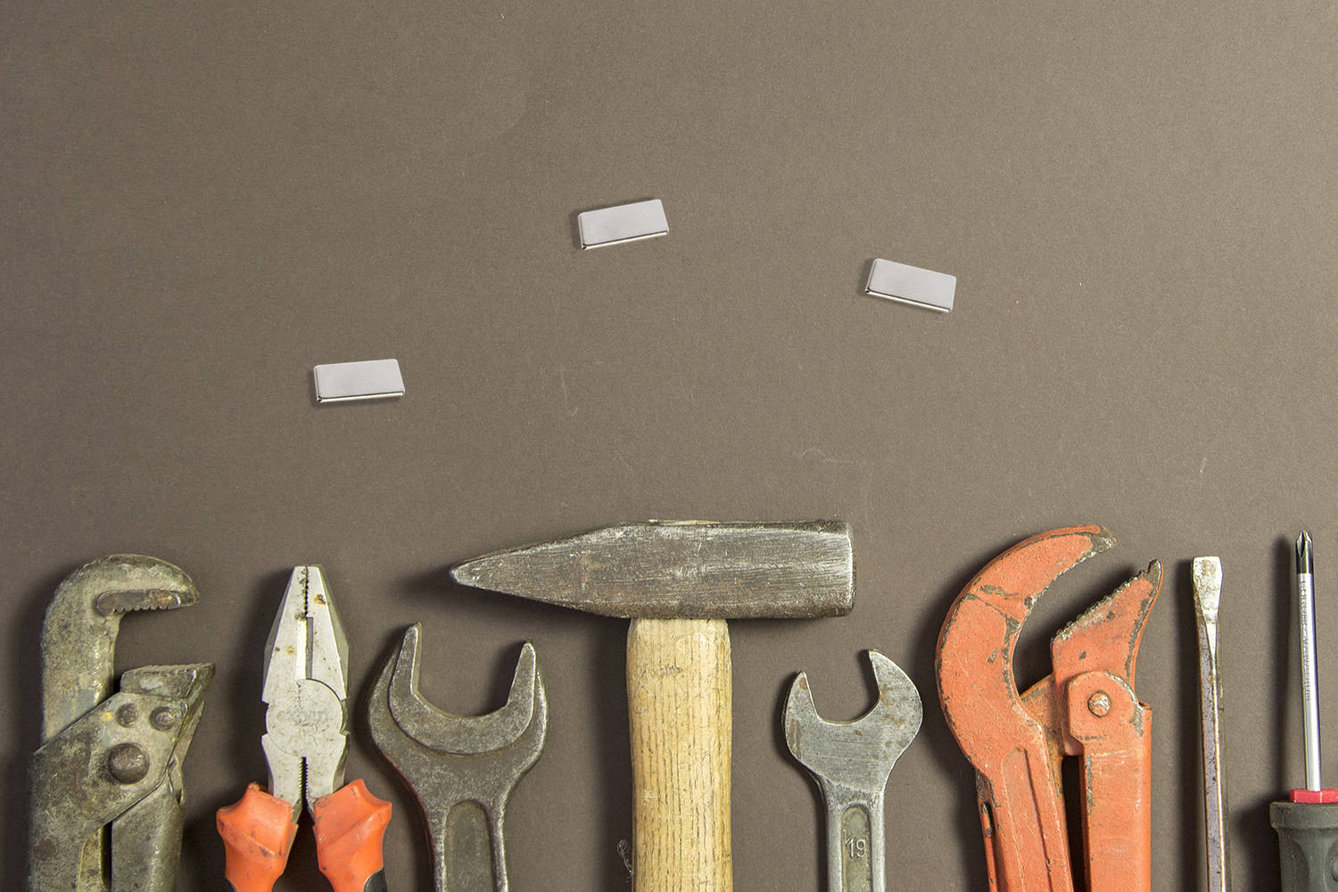Construction tools on textured grunge paper consisting of pipe w