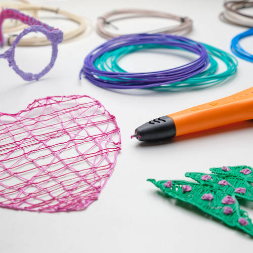 3d Pen. Printing with Colored Plastic Wire Filament. Child making a Christmas Three, Heart shape drawing with 3D pen. Artwork, Robotics. STEAM, STEM education. Modern Technologies. Study at home