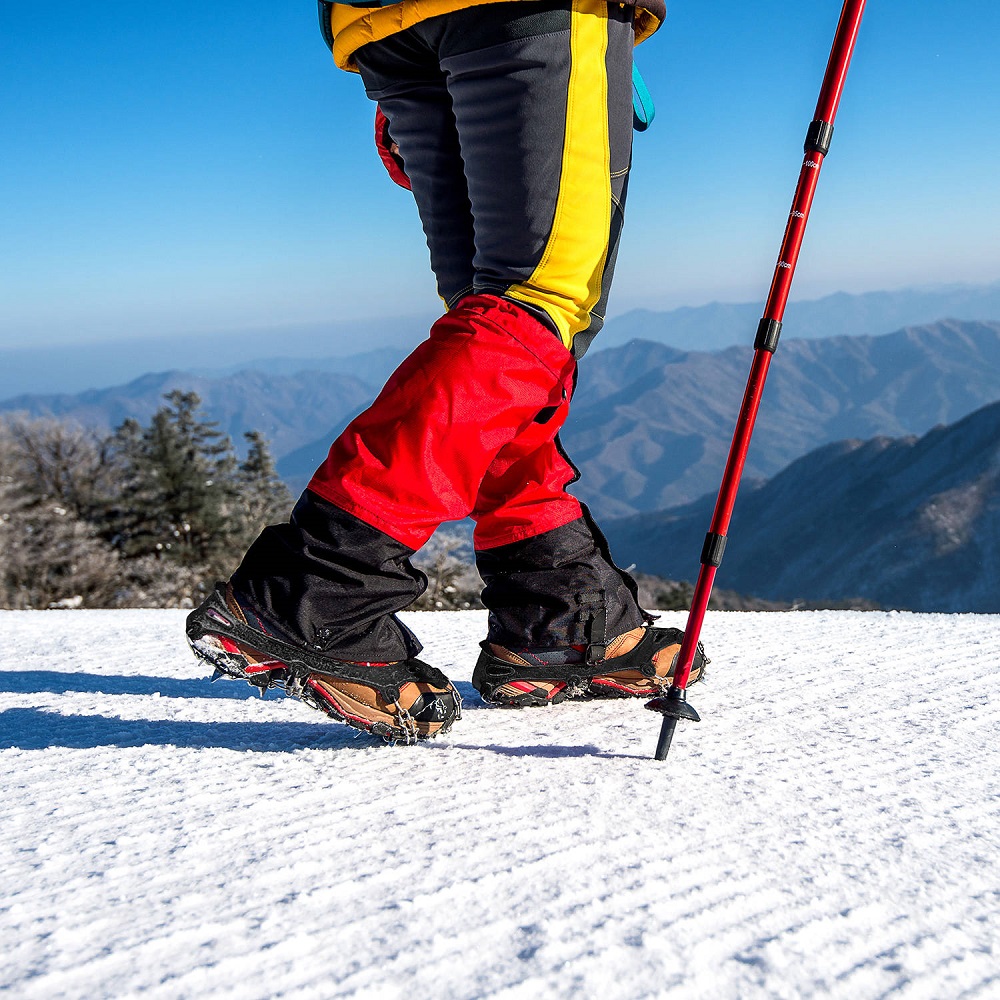 View of walking on snow with Snow shoes and Shoe spikes in winte